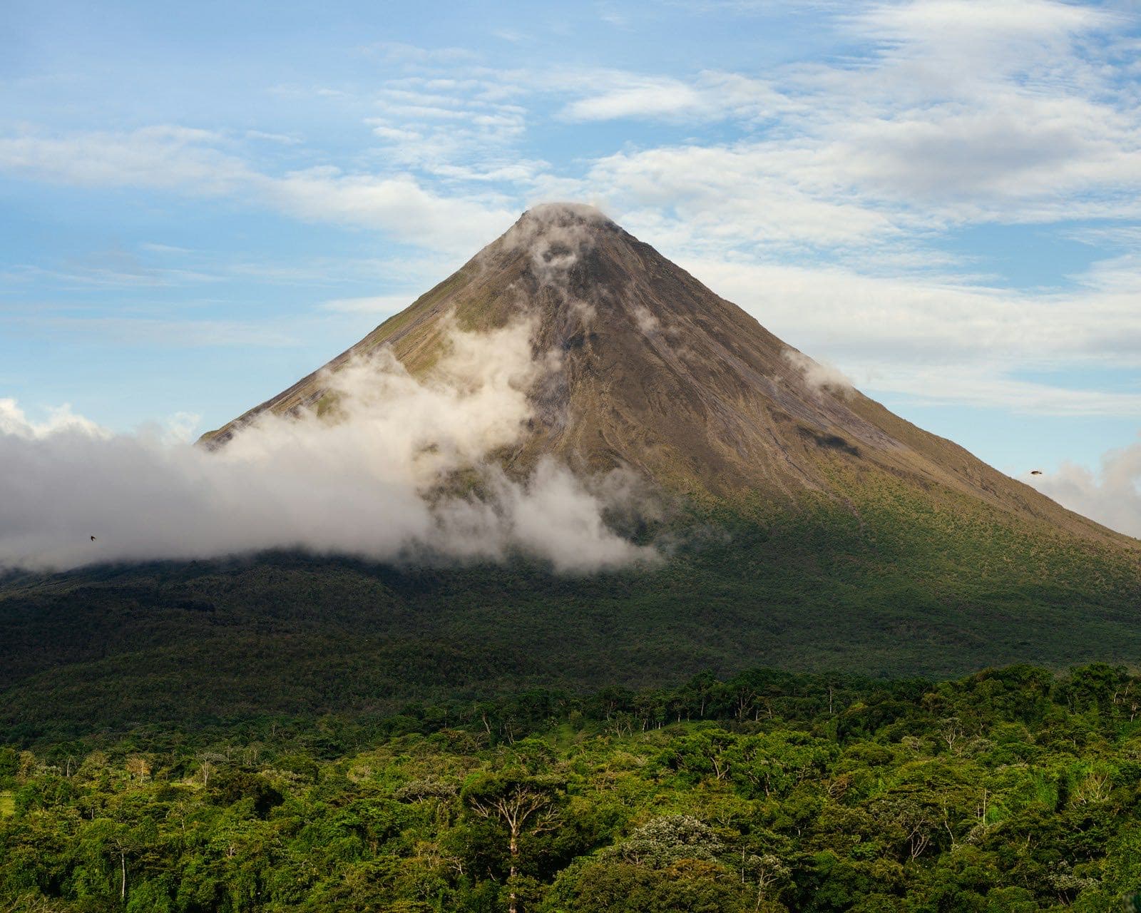 Arenal Volcano towering above the rainforest near La Fortuna